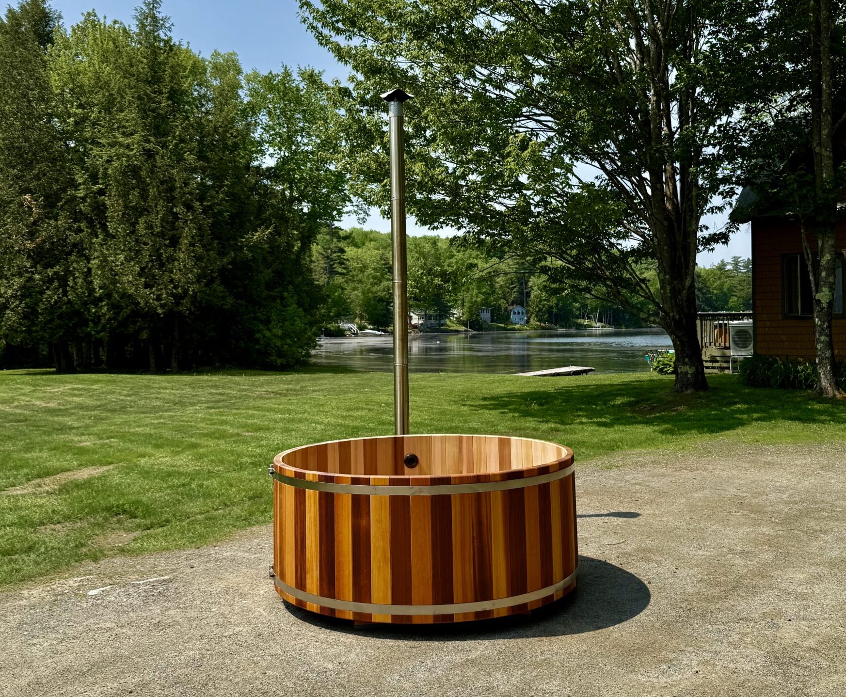 Shallow cedar wood-fired cedar hot tub.